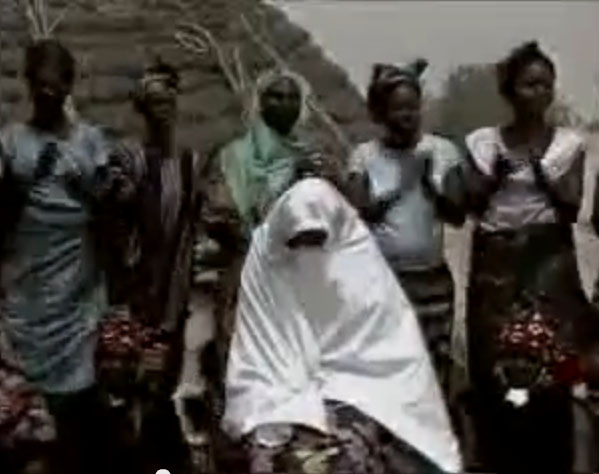 Half circel of women singing insults during Marcanda ritual
