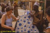 pagne, photo of a European woman bying a large piece of cloth