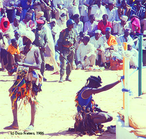 Tchali-tchali, tradional medicine man supporting wrestlers