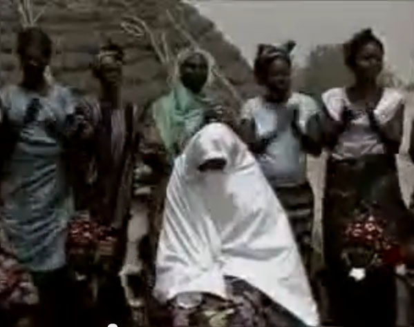 Half circel of women singing insults during Marcanda ritual
